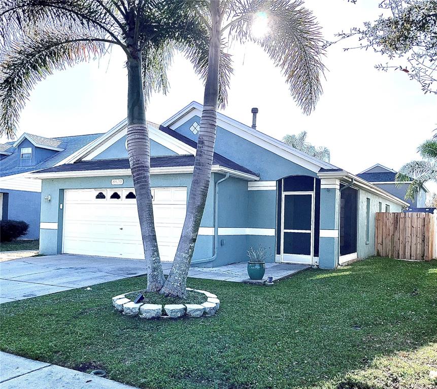 8620 Persea Court New Port Richey, FL 34655 - Photo 14 of 14 a view of a house with a yard