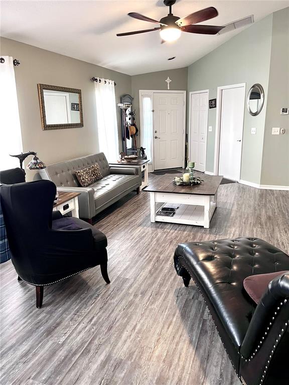 8620 Persea Court New Port Richey, FL 34655 - Photo 3 of 14 a living room with furniture and a wooden floor