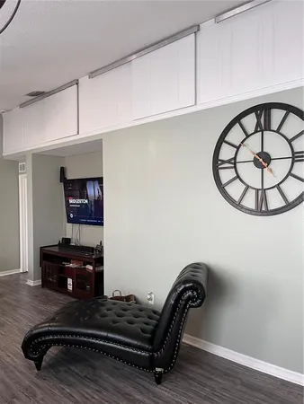 a kitchen with stainless steel appliances kitchen island granite countertop a stove a sink dishwasher and a microwave oven with cabinets