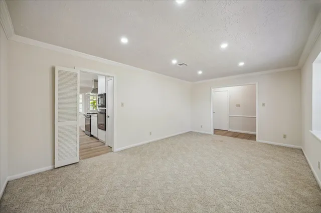 an empty room with closet and a yard