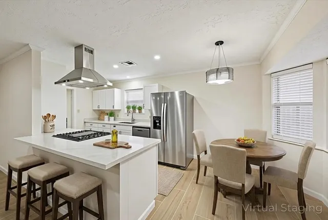 a view of an empty room with wooden floor and closet