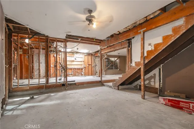 a view of an empty room with stairs