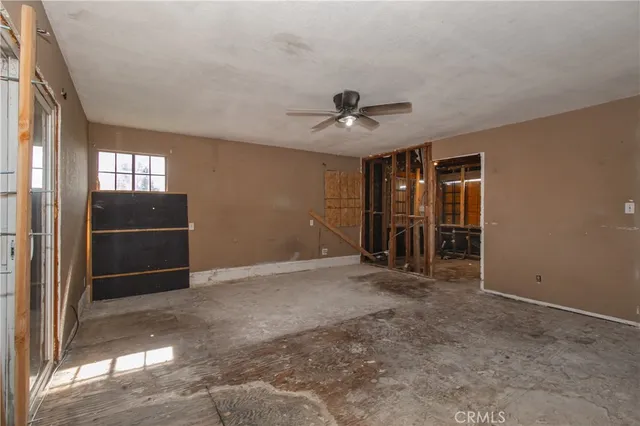 a view of an empty room with a fireplace