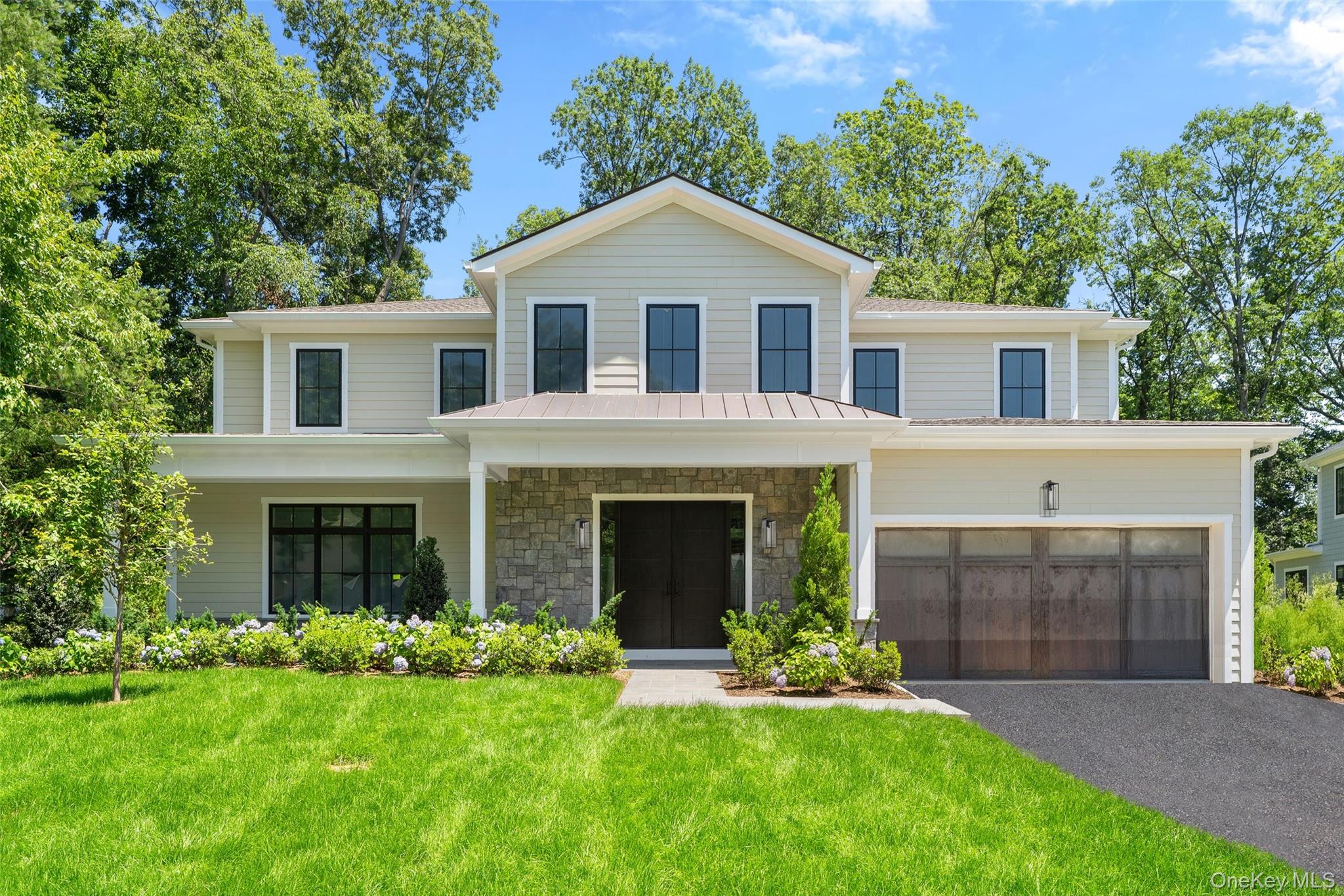 28 Aspen Road Scarsdale, NY 10583 - Photo 1 of 1 a front view of a house with a garden and yard