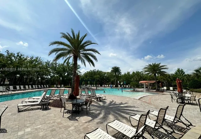 a view of swimming pool in front of lake