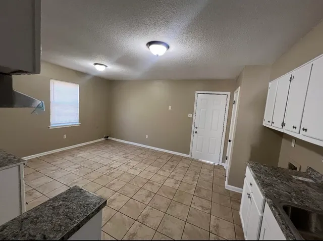 a view of a kitchen cabinets