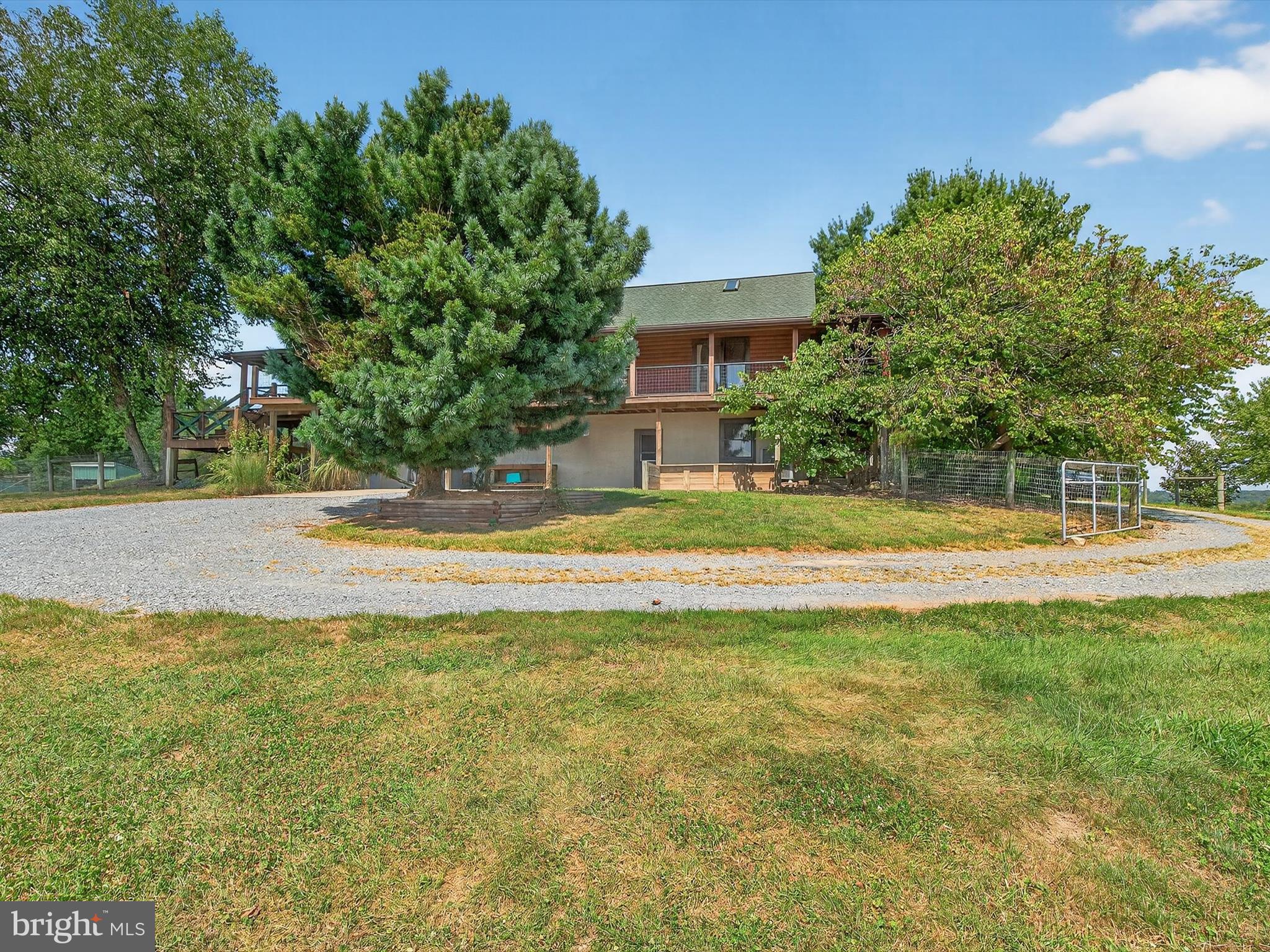 975 Cold Springs Road Elizabethtown, PA 17022 - Photo 44 of 56 a view of a swimming pool with a garden and trees