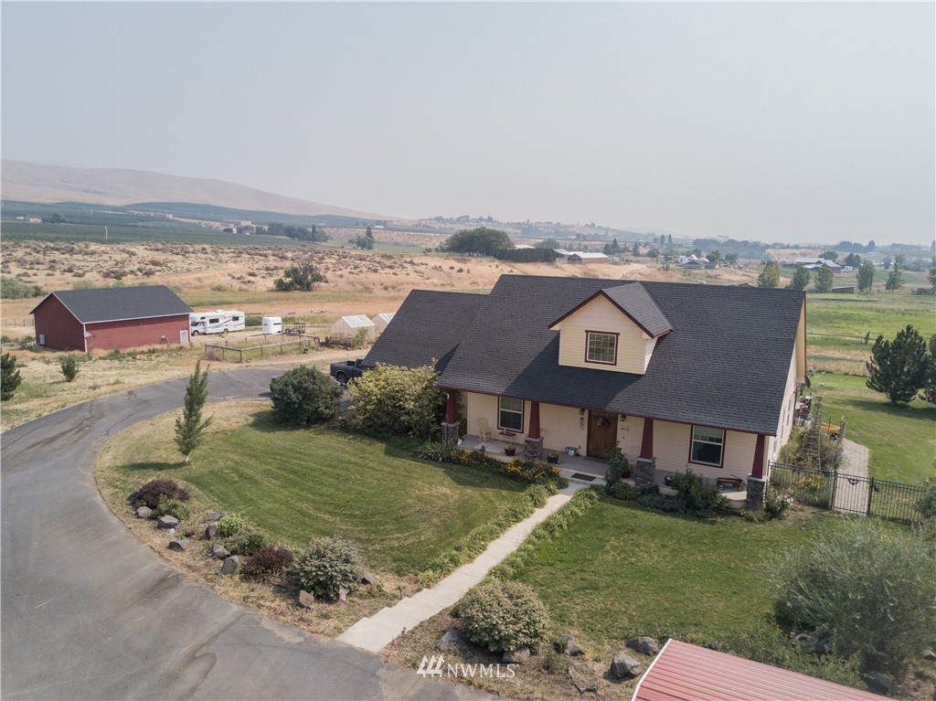 415 Bowers Road Yakima, WA 98908 - Photo 1 of 25 an aerial view of a house with a garden and lake view