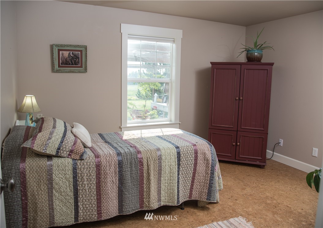 415 Bowers Road Yakima, WA 98908 - Photo 13 of 25 a bed sitting in a bedroom next to a window