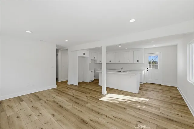 a view of a kitchen with wooden floor
