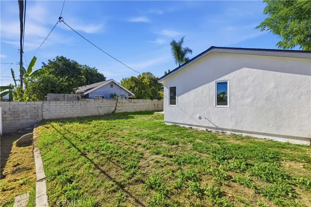 a backyard of a house with lots of green space