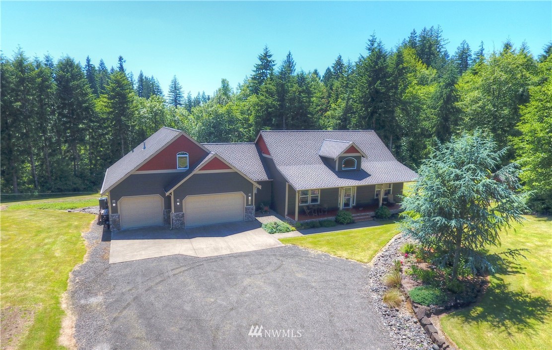 15837 Case Road Southwest Rochester, WA 98579 - Photo 2 of 40 a view of a house with swimming pool and a yard