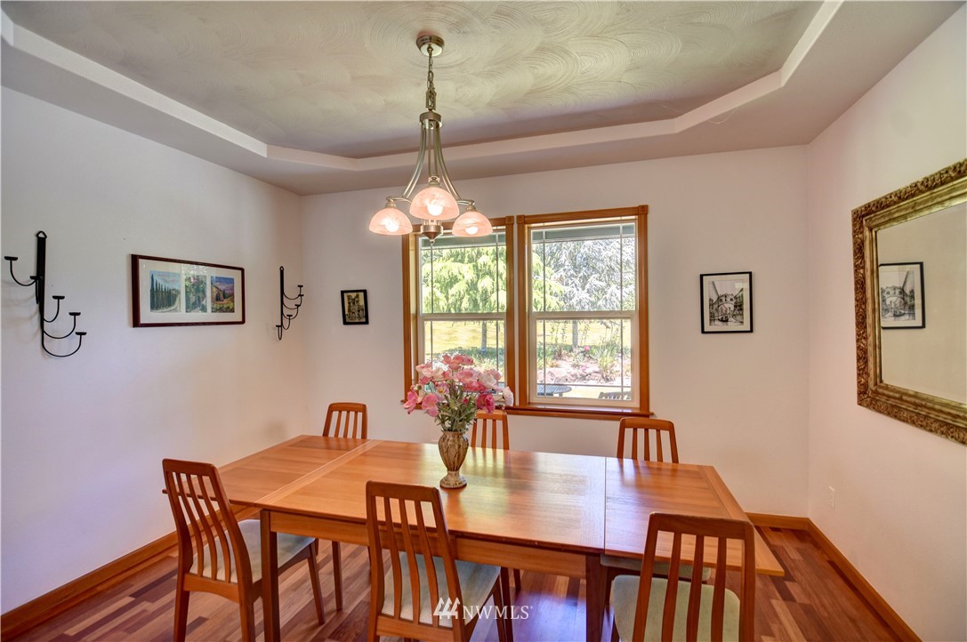 15837 Case Road Southwest Rochester, WA 98579 - Photo 11 of 40 a view of a dining room with furniture window and wooden floor