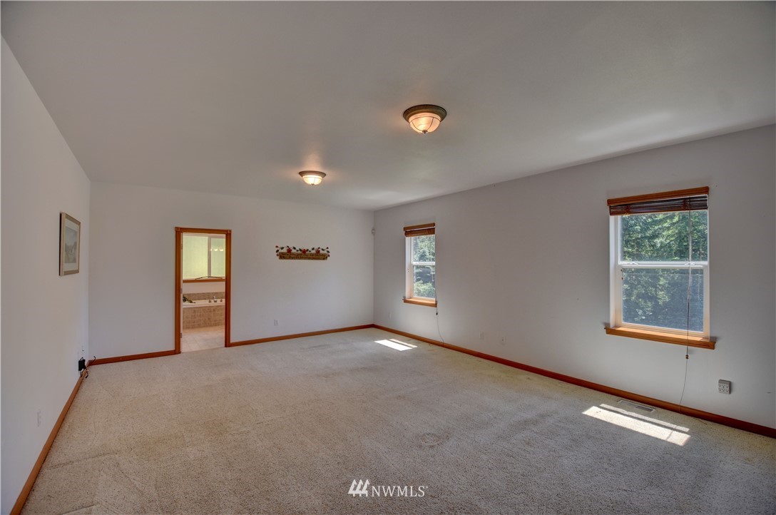 15837 Case Road Southwest Rochester, WA 98579 - Photo 12 of 40 an empty room with windows and closet