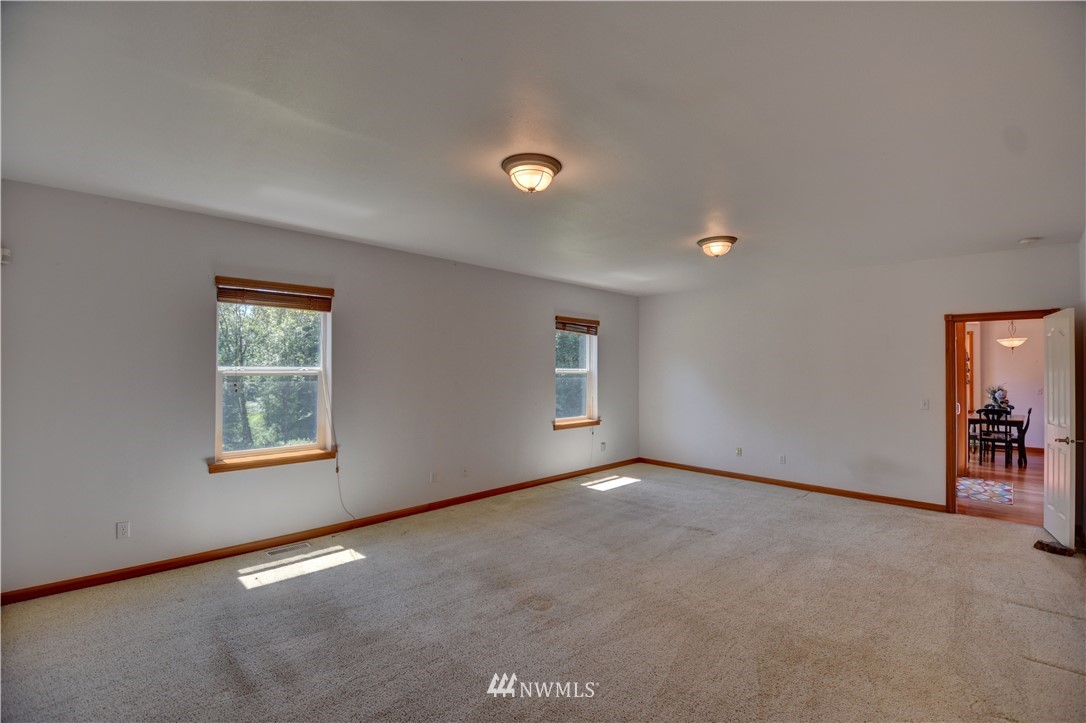 15837 Case Road Southwest Rochester, WA 98579 - Photo 13 of 40 an empty room with windows and closet