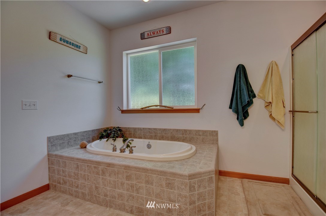15837 Case Road Southwest Rochester, WA 98579 - Photo 15 of 40 a bathroom with a sink and mirror