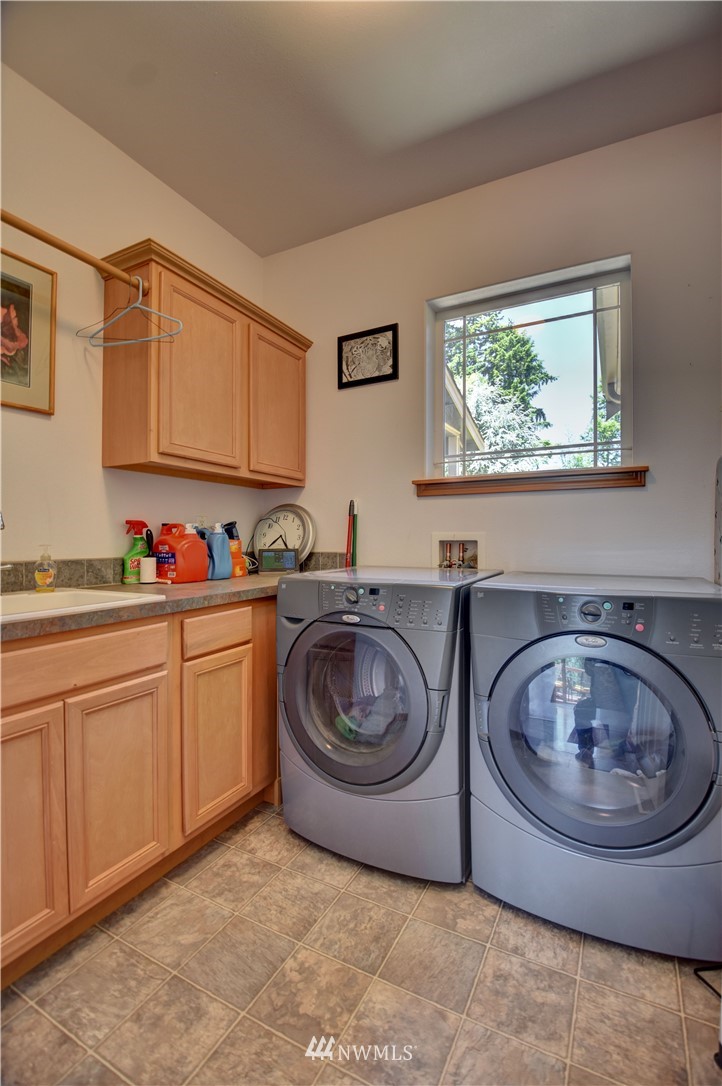15837 Case Road Southwest Rochester, WA 98579 - Photo 19 of 40 a utility room with sink washer and dryer