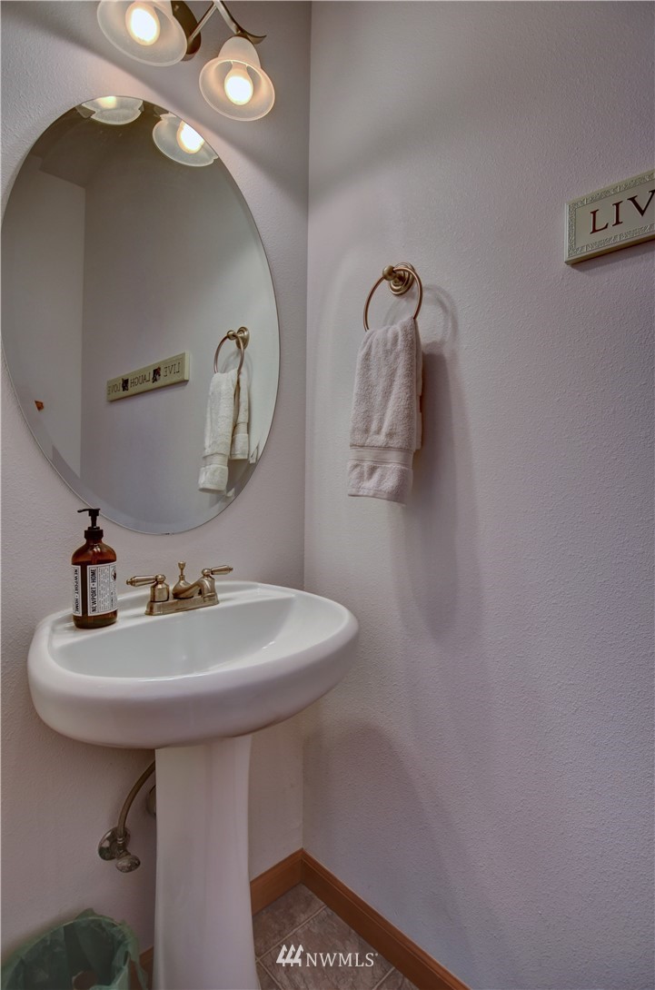 15837 Case Road Southwest Rochester, WA 98579 - Photo 20 of 40 a bathroom with a sink a mirror and vanity