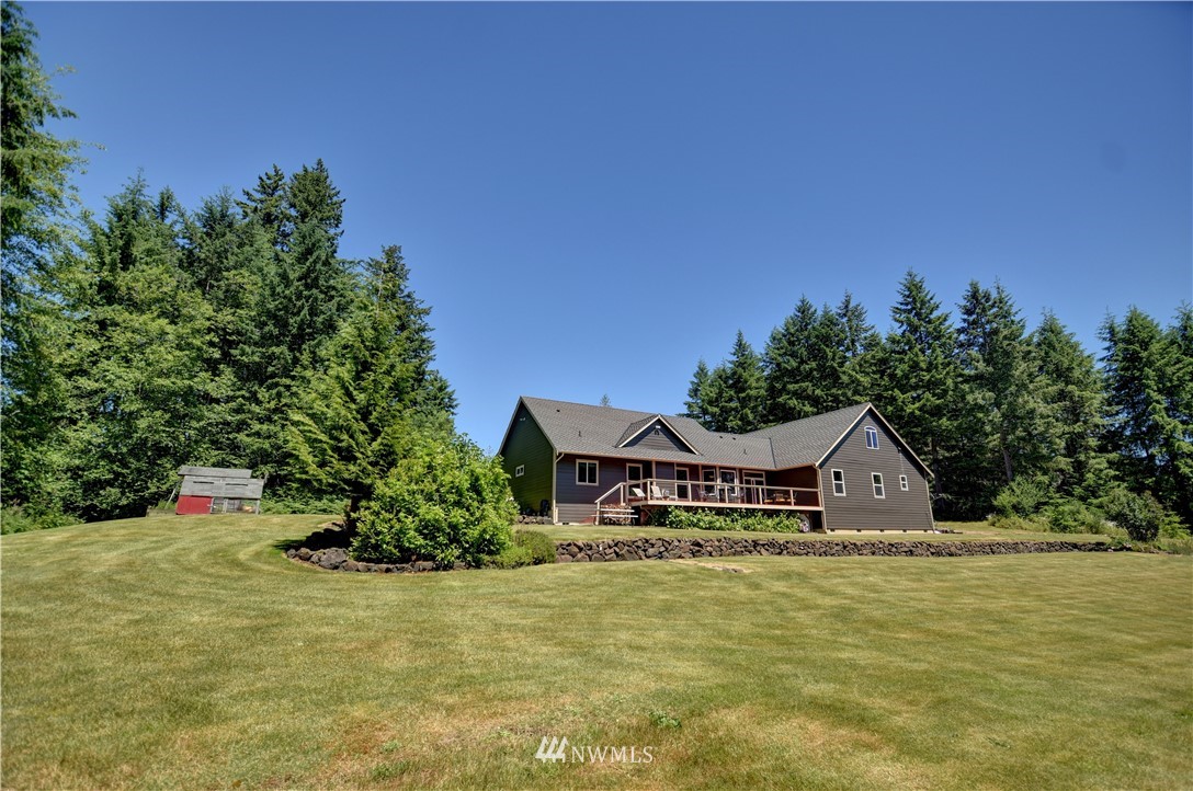 15837 Case Road Southwest Rochester, WA 98579 - Photo 27 of 40 a front view of a house with a yard and garage
