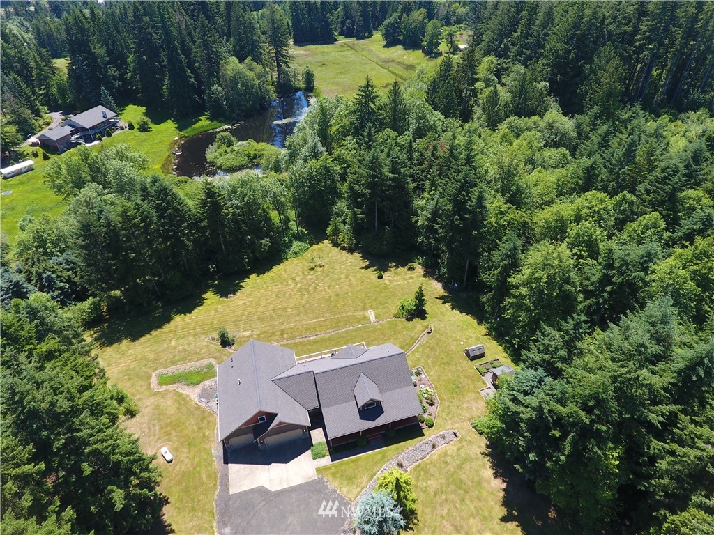 15837 Case Road Southwest Rochester, WA 98579 - Photo 39 of 40 an aerial view of a house with a yard lake and trees all around