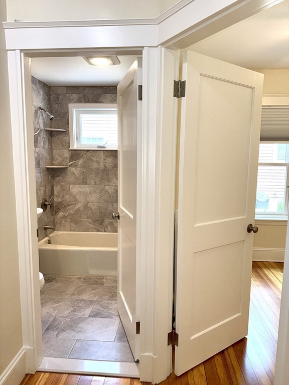 39 Newman Road Malden, MA 02148 - Photo 12 of 27 a bathroom with a glass shower door