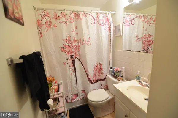 a bedroom with bed and a window