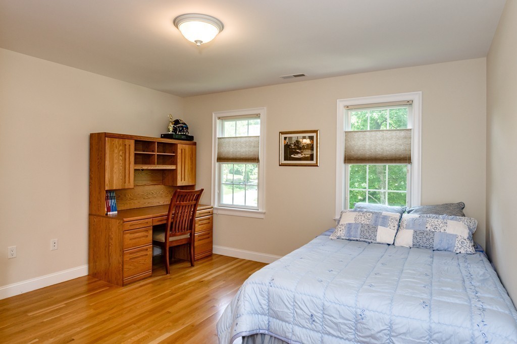 24 Overlook Drive Bedford, MA 01730 - Photo 23 of 30 a bedroom with a bed and a window
