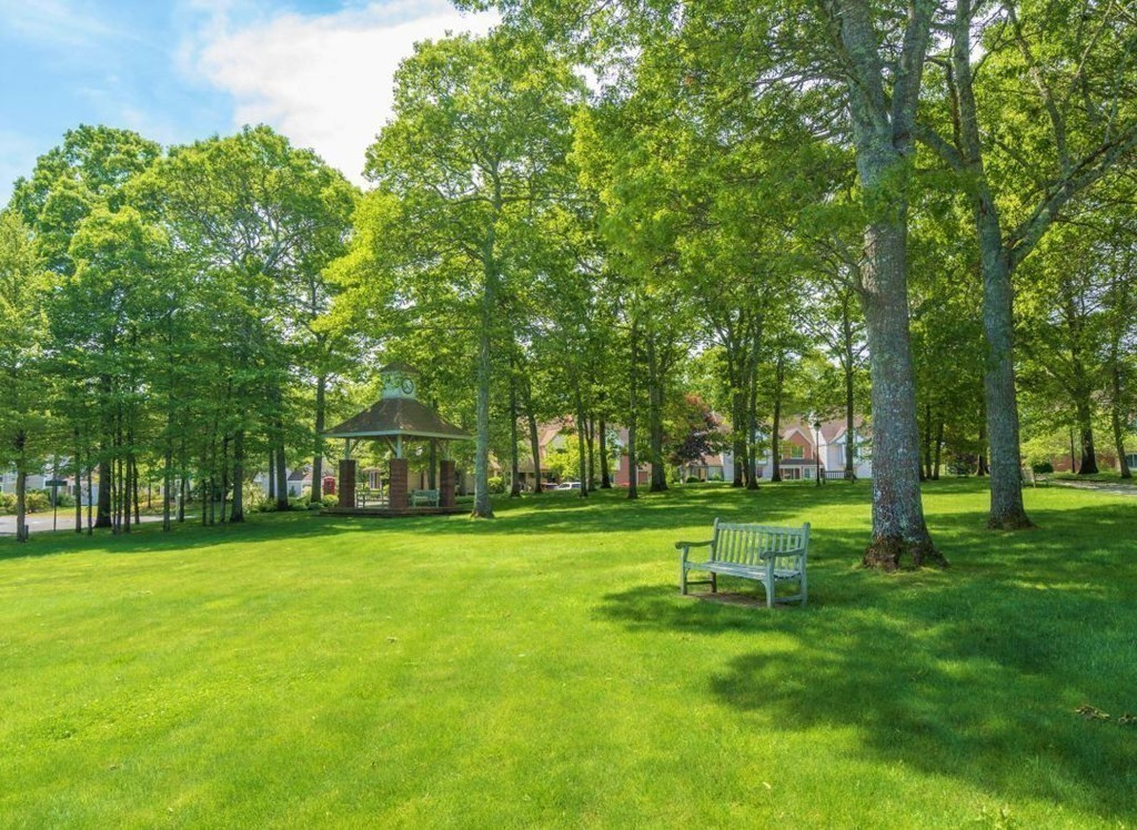 14 Stratford Ridge, Unit 14 Mashpee, MA 02649 - Photo 20 of 23 a garden with trees in the background