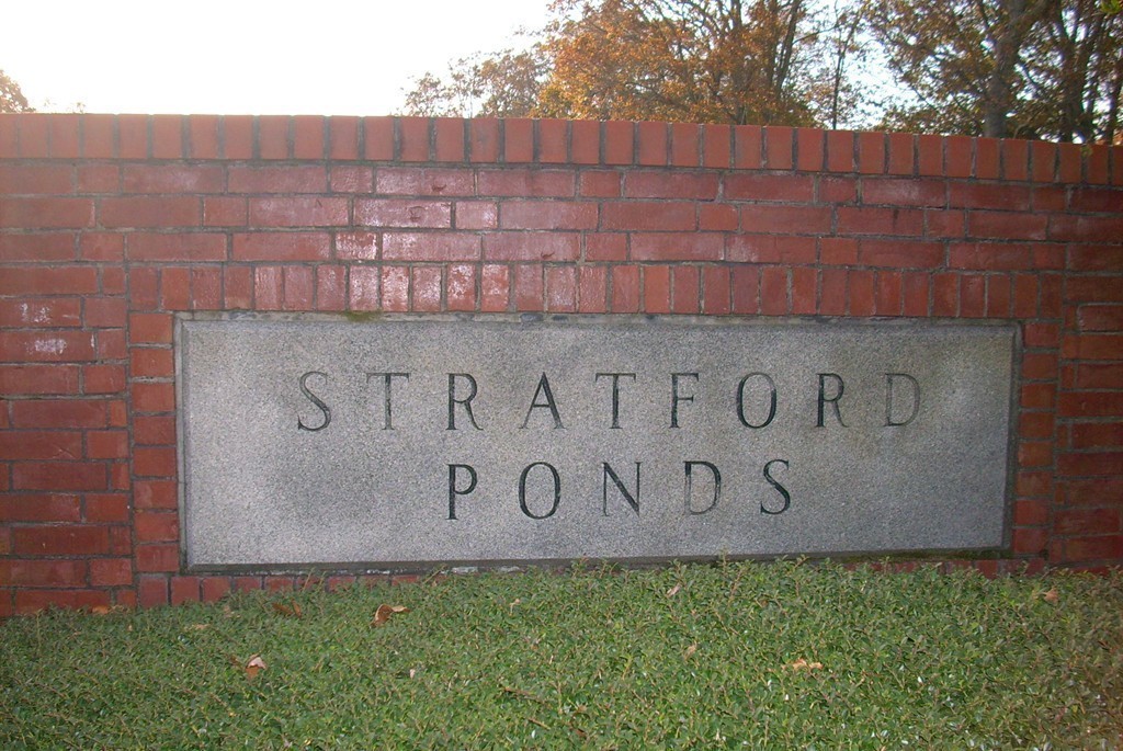 14 Stratford Ridge, Unit 14 Mashpee, MA 02649 - Photo 23 of 23 a street sign that is on a brick wall