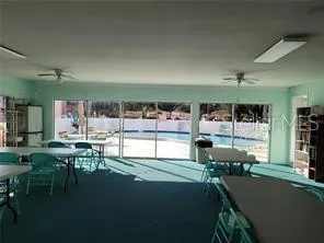 a room with lots of table and chairs