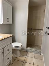 13250 Ridge Road, Unit 3B1 Largo, FL 33778 - Photo 8 of 15 a bathroom with a toilet