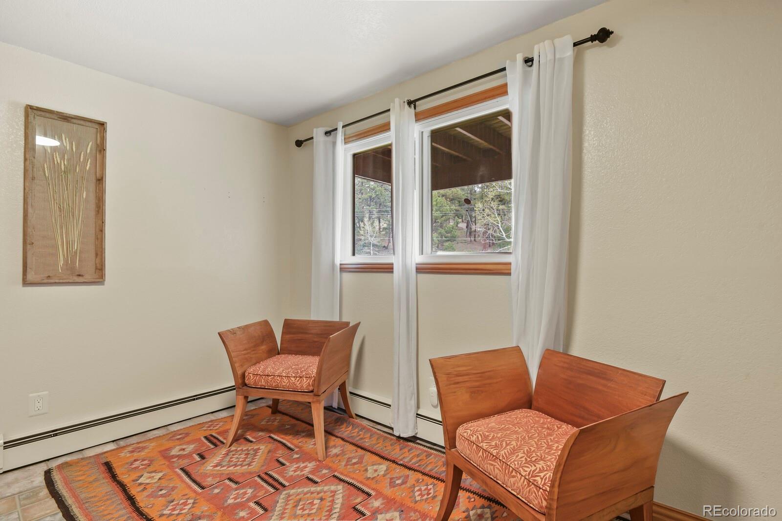 417 Witter Gulch Road Evergreen, CO 80439 - Photo 43 of 50 a living room with furniture and a window