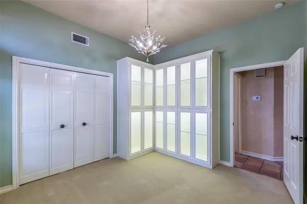 a view of a chandelier and window in a room