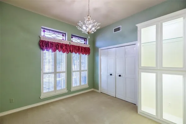 a view of a chandelier and window in the room