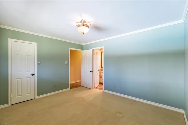 an empty room with a empty space and windows