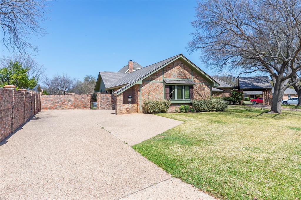 50 Riviera Circle Abilene, TX 79606 - Photo 3 of 40 a front view of a house with a yard and garage