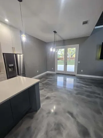 a view of a hallway with windows