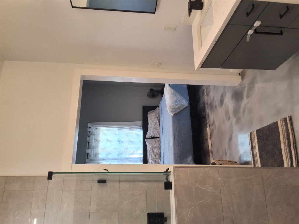 724 Ramsey Avenue Rockdale, TX 76567 - Photo 19 of 36 a bathroom with a sink and a bathtub