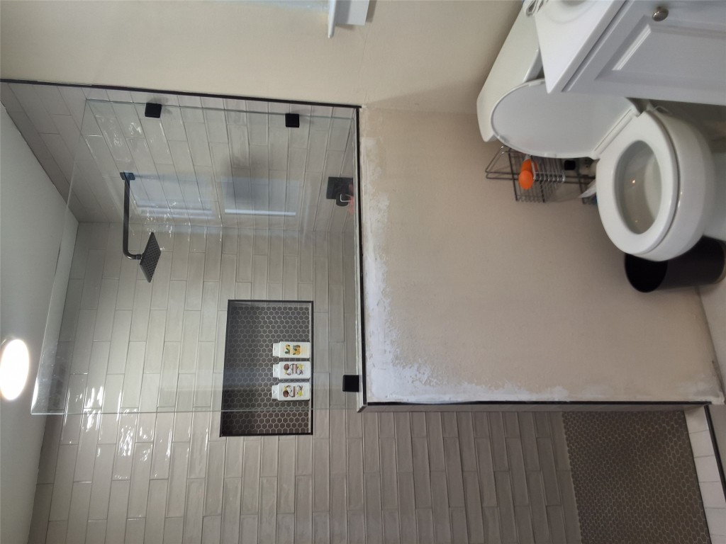 724 Ramsey Avenue Rockdale, TX 76567 - Photo 20 of 36 a bathroom with a toilet a sink and mirror