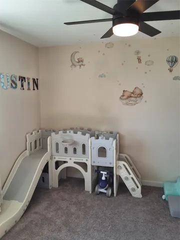 a bedroom with a bed and a table