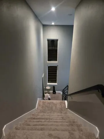 a view of a room with a staircase