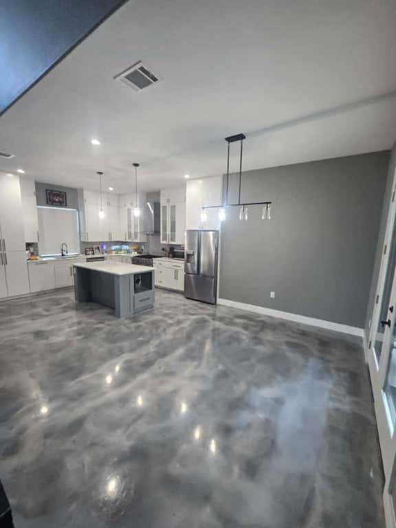 724 Ramsey Avenue Rockdale, TX 76567 - Photo 9 of 36 a view of a kitchen and a window