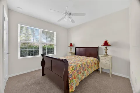 a bedroom with a bed and a table