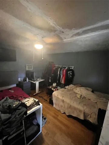 a bathroom with a toilet and a shower curtain