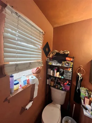 a view of a house with backyard porch and sitting area