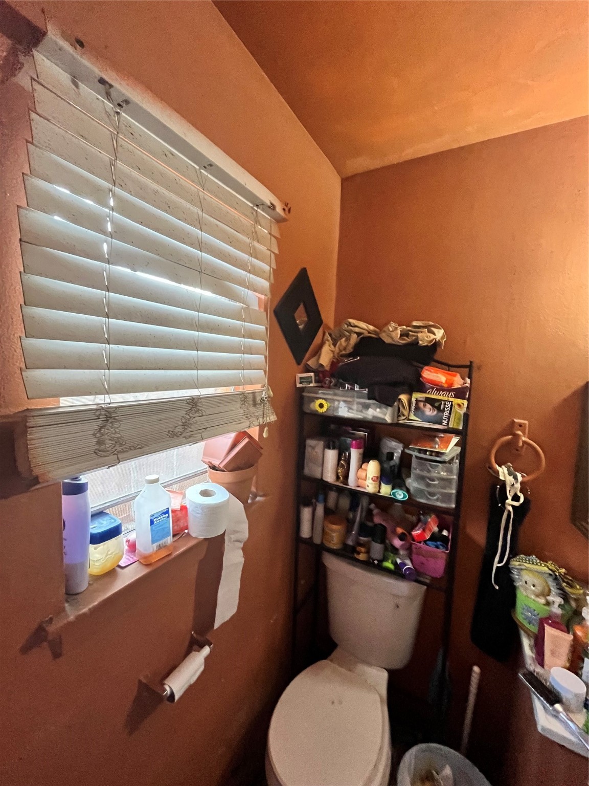 4306 Kelling Street Houston, TX 77045 - Photo 13 of 15 a bathroom with a toilet and a shower curtain