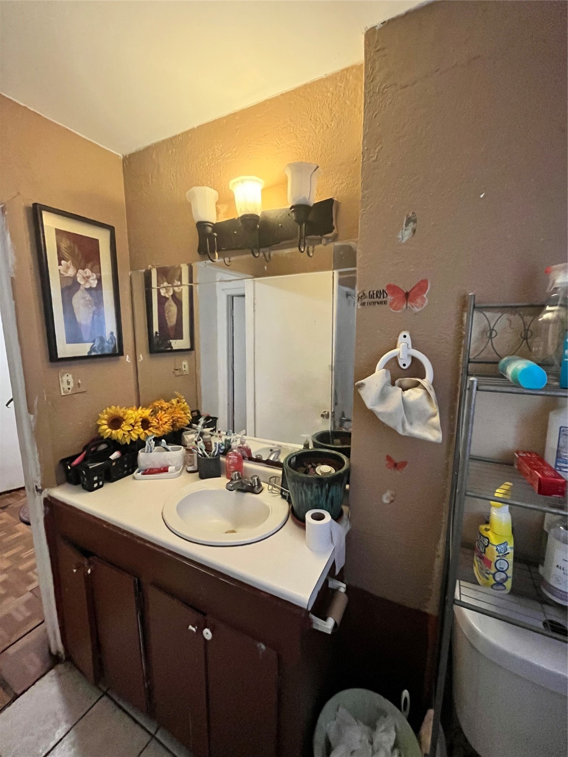 4306 Kelling Street Houston, TX 77045 - Photo 14 of 15 a bathroom with a sink vanity and a mirror