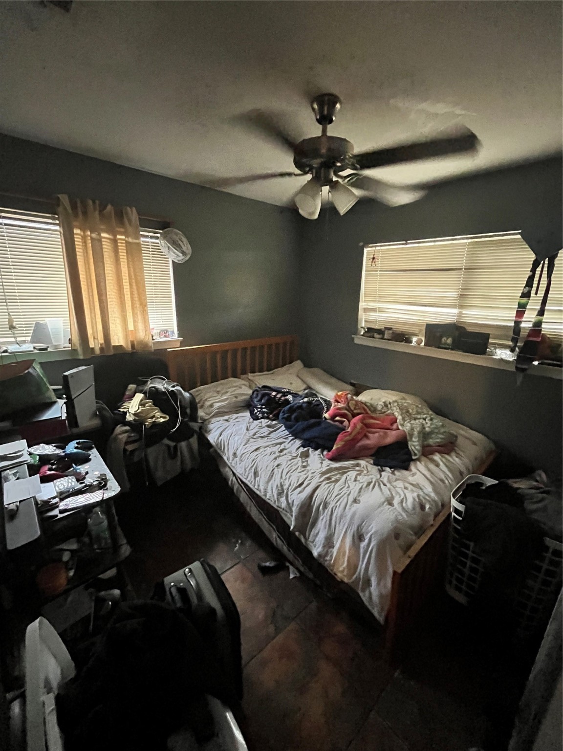 4306 Kelling Street Houston, TX 77045 - Photo 10 of 15 a bed sitting in a bedroom next to a window