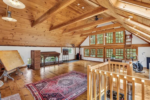 a view of a swimming pool with seating space
