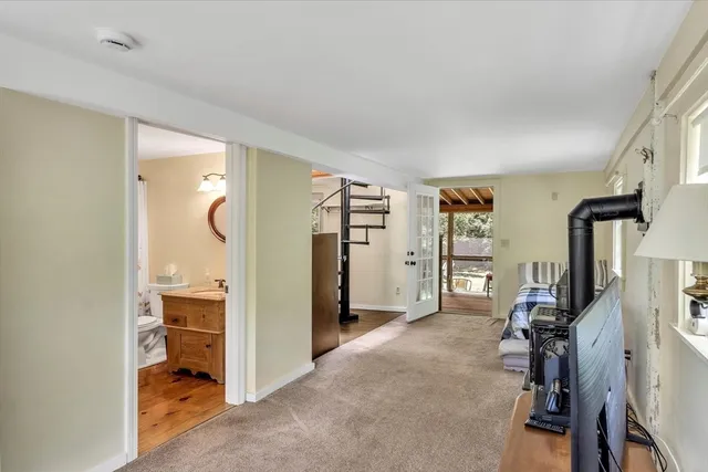 a bathroom with a granite countertop sink toilet mirror and shower